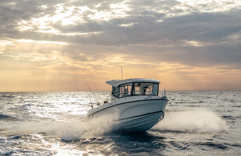 Pilothouse running through golden morning seas