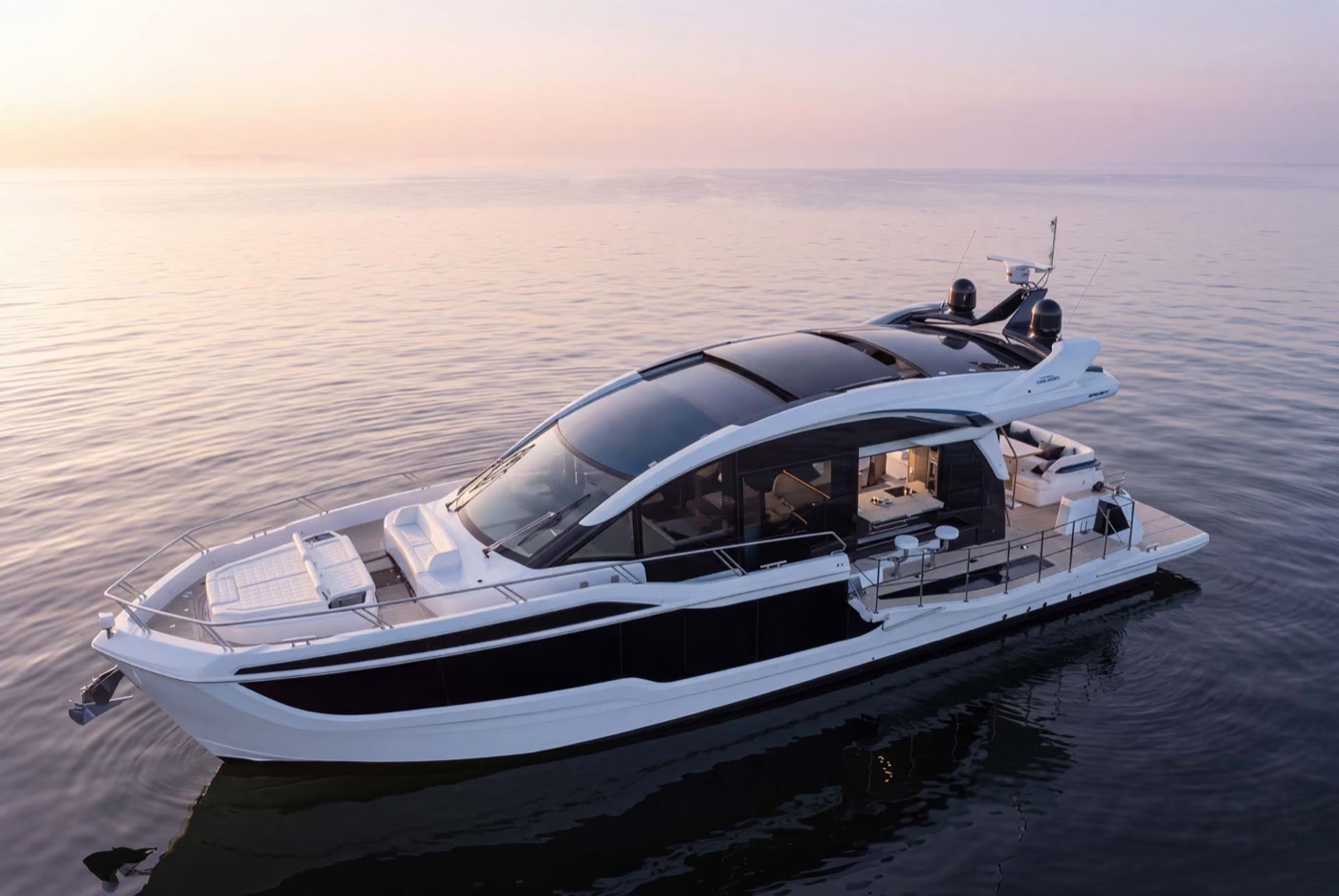 Galeon 570 SKY at anchor at dusk, profile view
