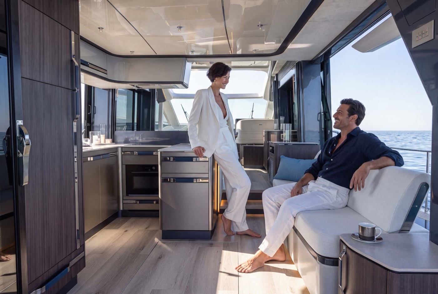 Main-deck saloon and open galley with guests relaxing