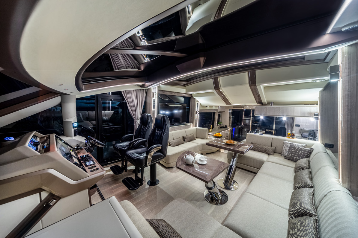 700 SKY main-deck saloon: helm station and L-shaped lounge