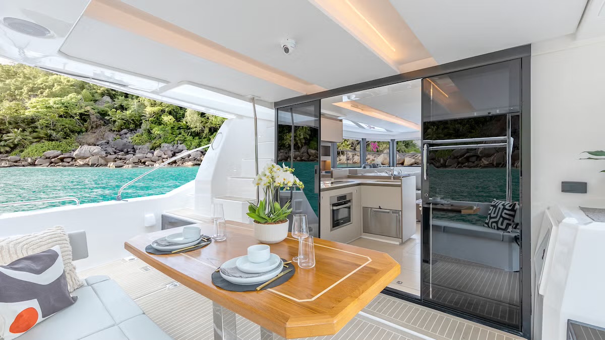 40PC aft cockpit dining table open to the galley