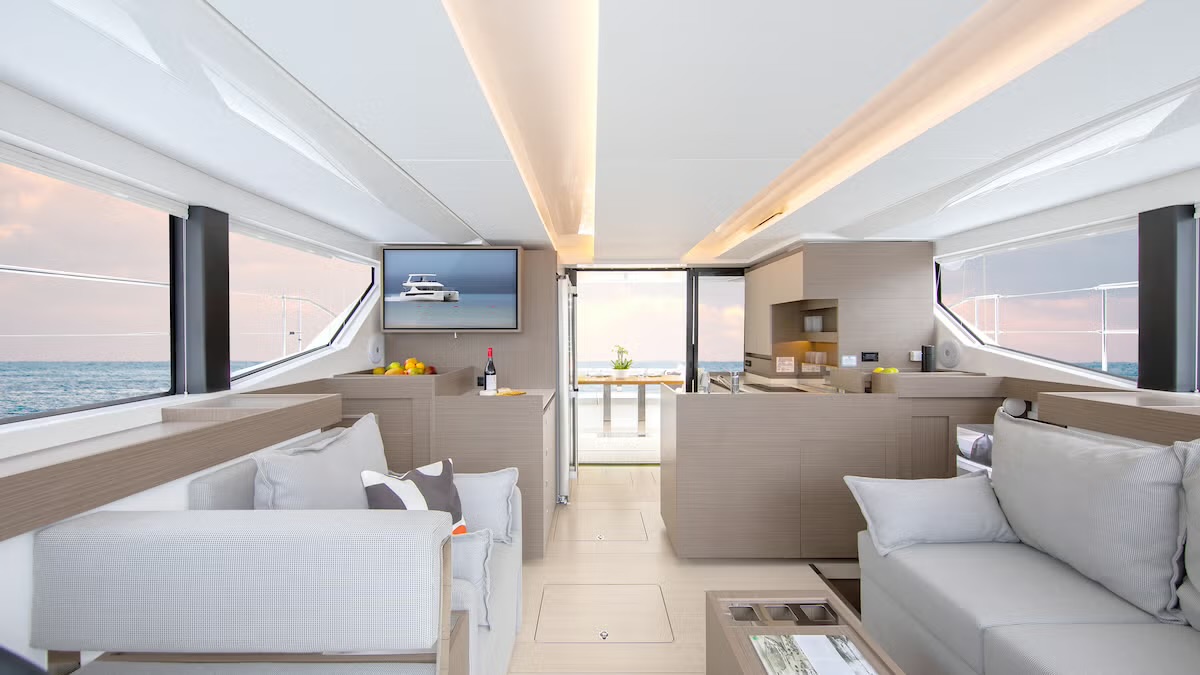 The 40PC flybridge: helm, dining table and grill beneath the hardtop