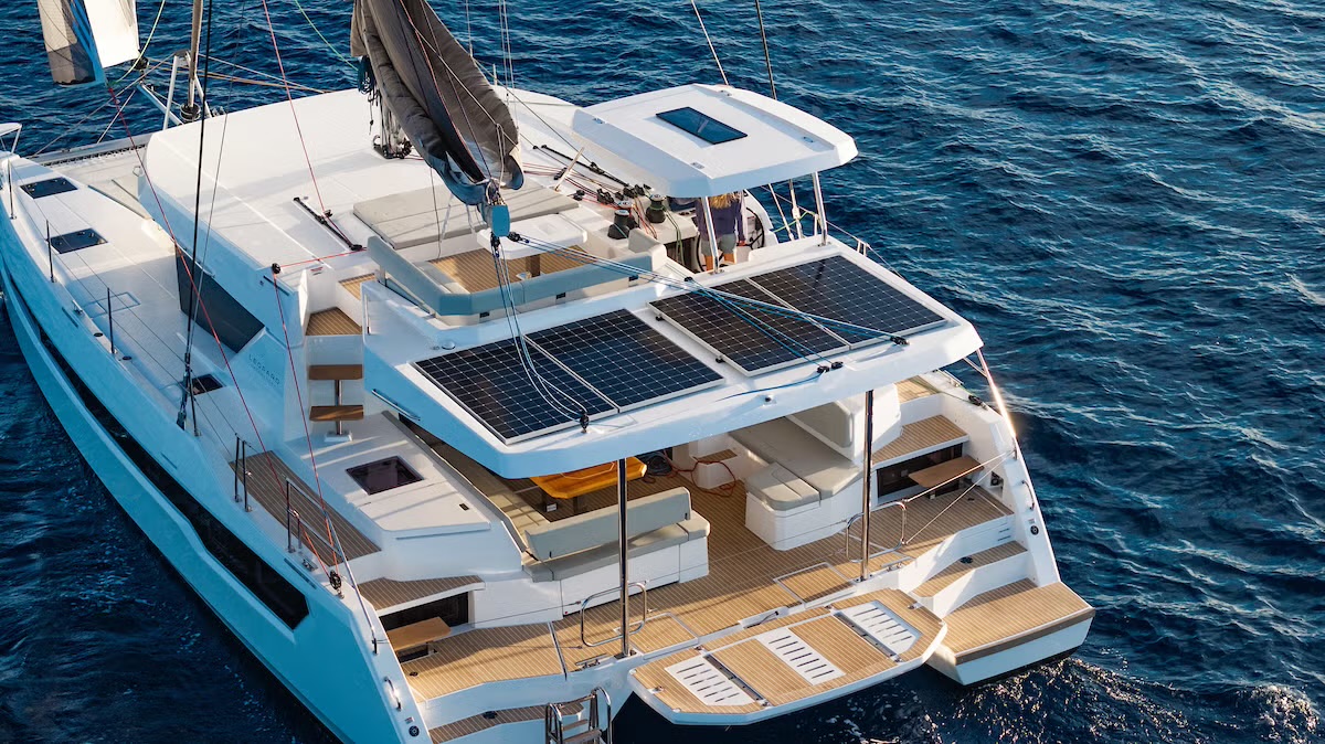 Leopard 46 saloon galley with drawer refrigeration and TV, looking aft to the cockpit dining