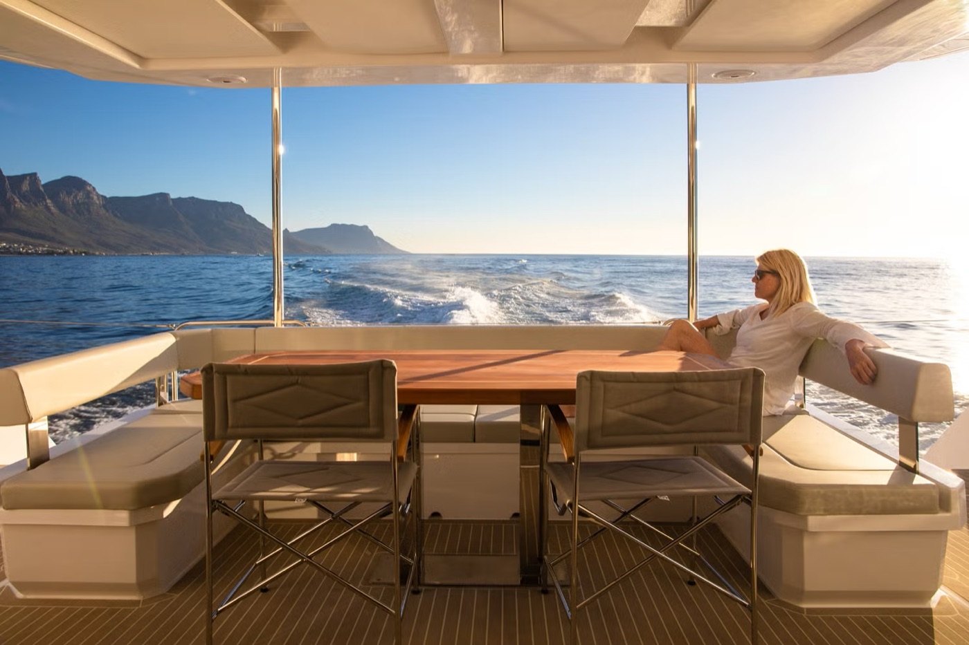 46PC aft cockpit dining area under way, wake astern