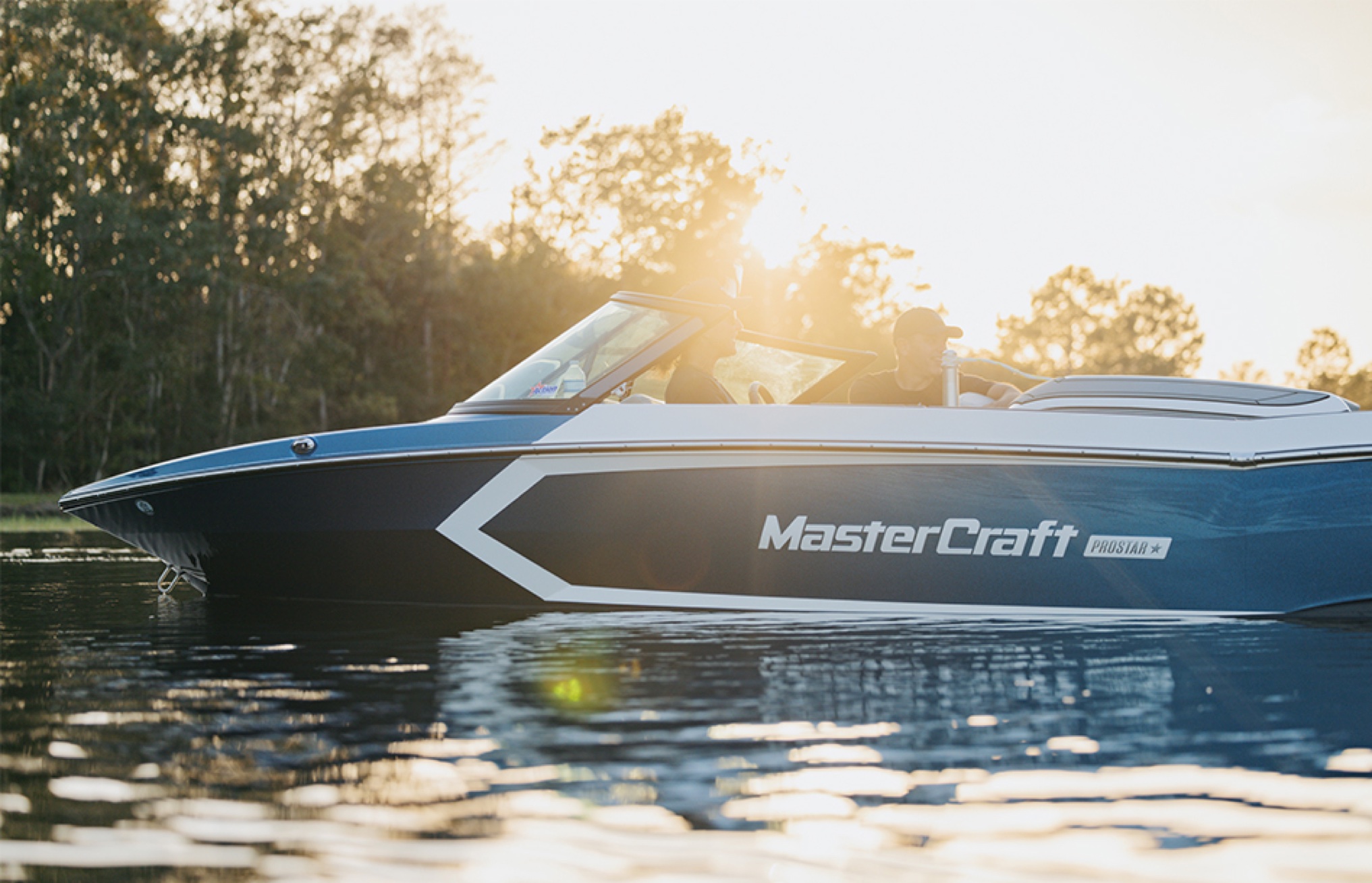 ProStar cutting a golden wake at dusk