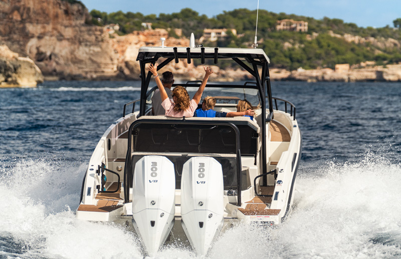 Navan S30 stern view — twin Mercury 300 V8 outboards powering a family cruise