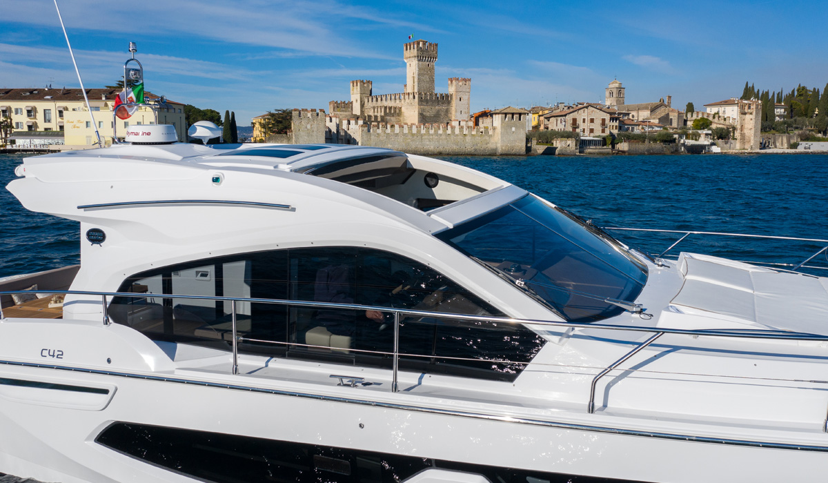 C42 profile before a lakeside castle