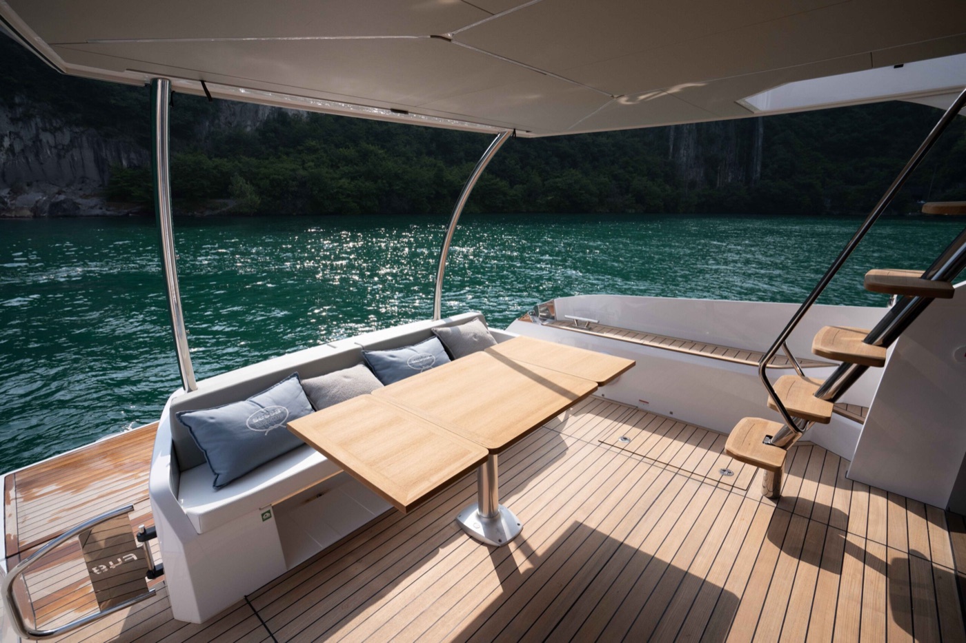 Fly 48 cockpit dining, cliffs and clear water