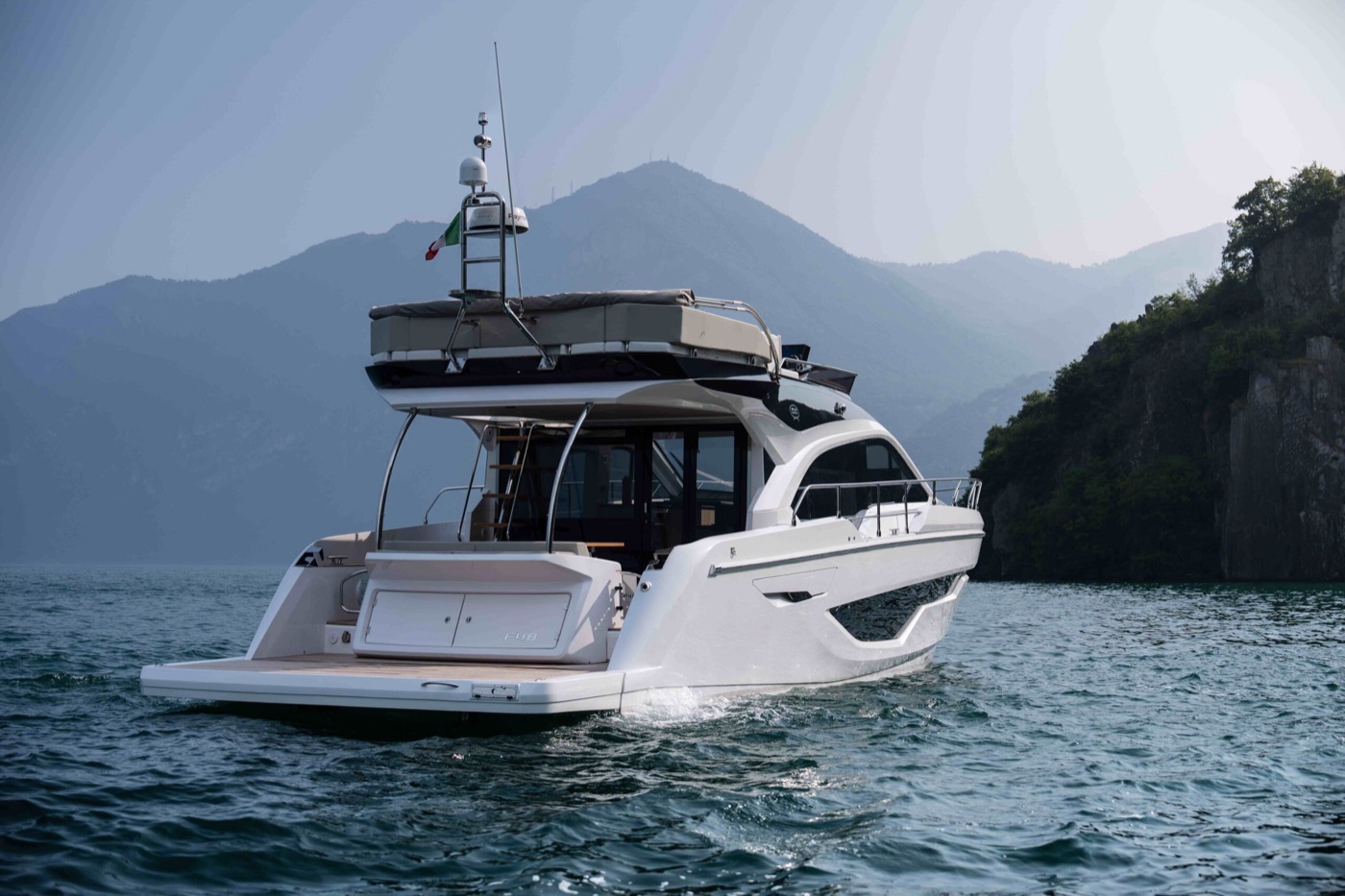 Fly 48 — Stern-quarter profile with swim platform