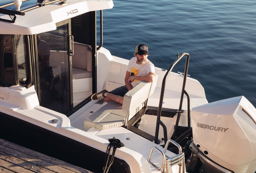 EXPLR 9 aft deck fold-down seat and Mercury outboard
